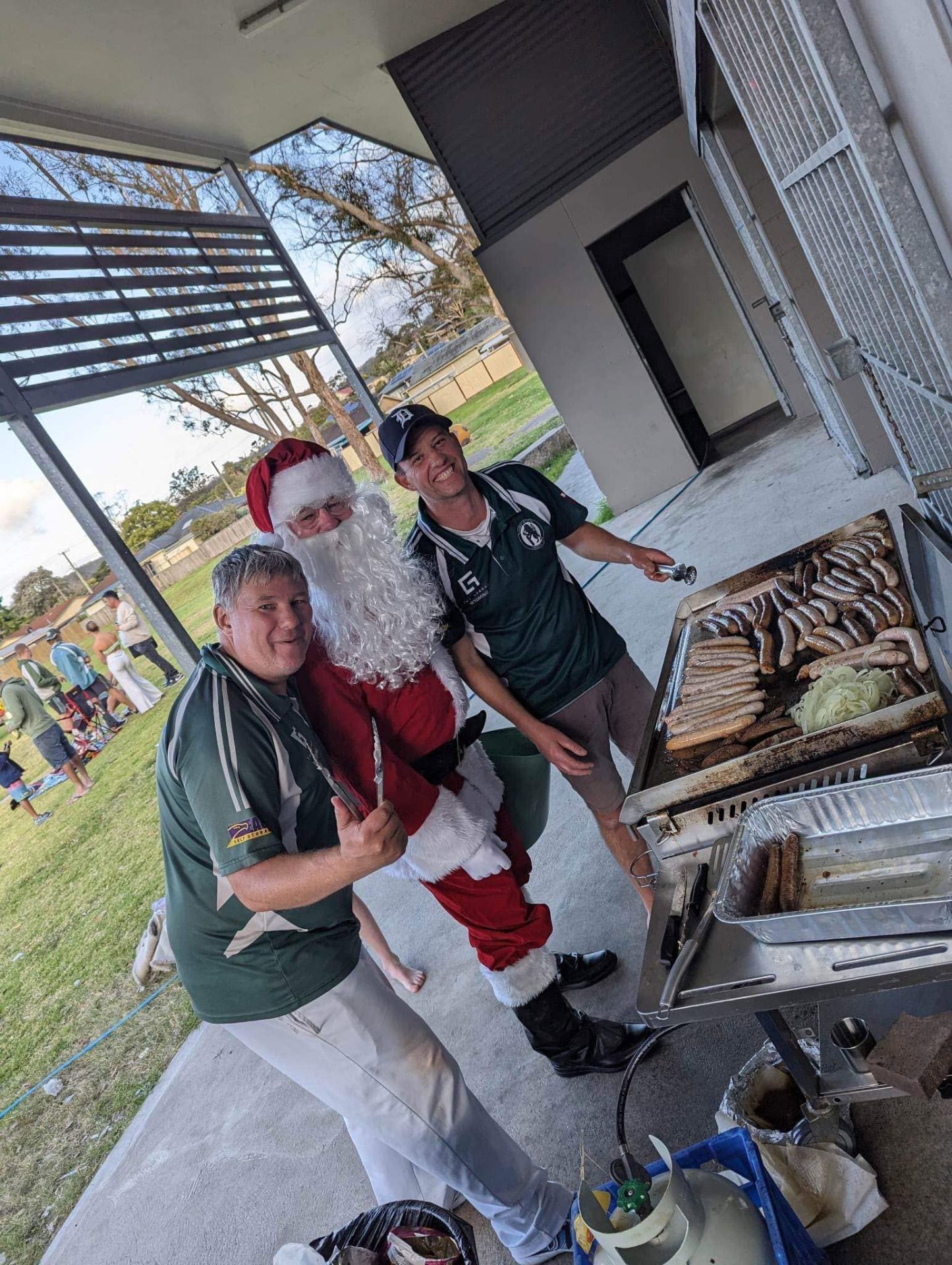 Santa lending a hand at the club sausage sizzle