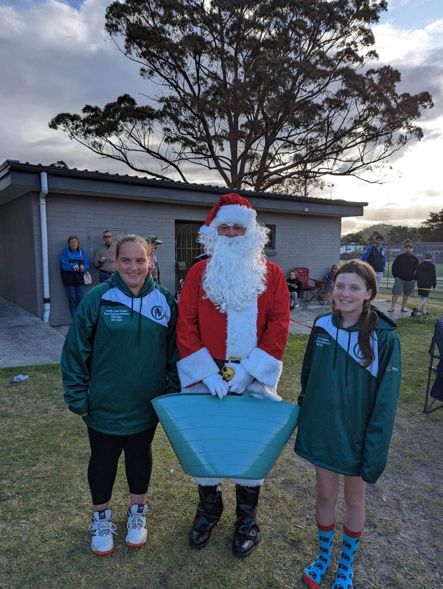 Two young players posing with Santa at the club rooms