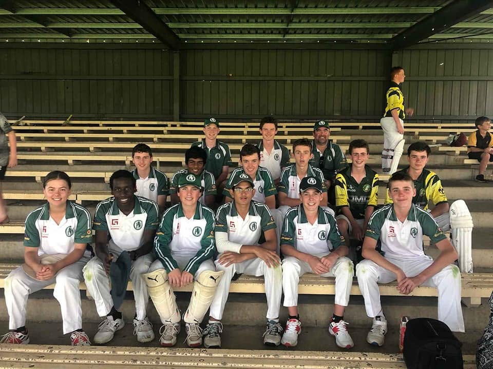 Junior team gathered on the bleachers after a match